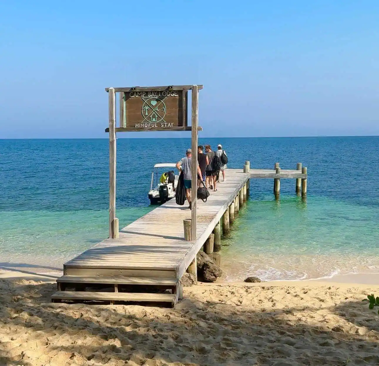People walking out on dock in Camp Bay Lodge